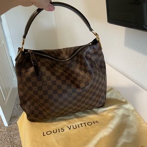 Gently used authentic Louis Vuitton portobello pm Damier